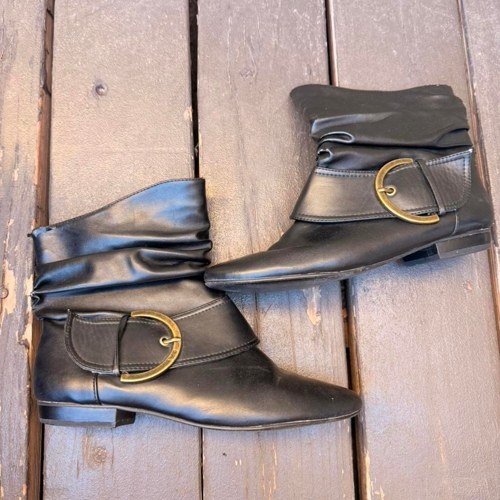 Black ankle boots with gold buckle
